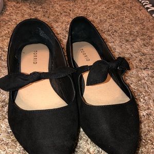 Black suede flats with bow